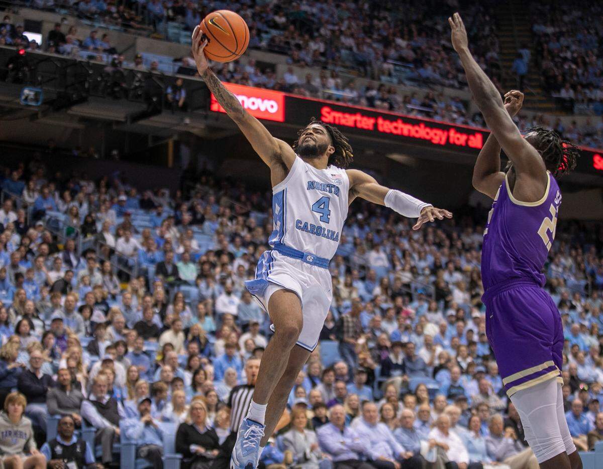 North Carolina’s R.J. Davis (4) drives to the basket against James Madison’s Alonzo Sule (25) in the first half on Sunday, November 20, 2022 at the Smith Center in Chapel Hill, N.C.