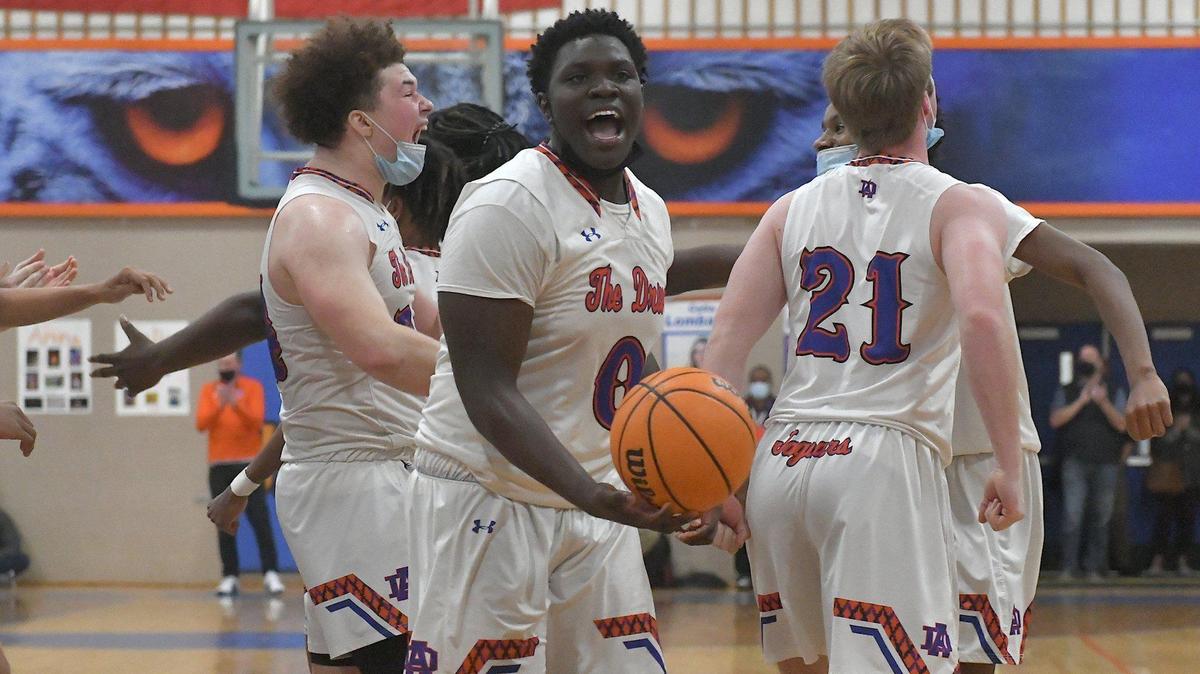 Athens Drive’s Anthony Jamison (0) celebrates after this team defeated Cardinal Gibbons. The Athens Drive Jaguars and the Cardinal Gibbons Crusaders met in a basketball game in Raleigh, N.C. on February 11, 2022.