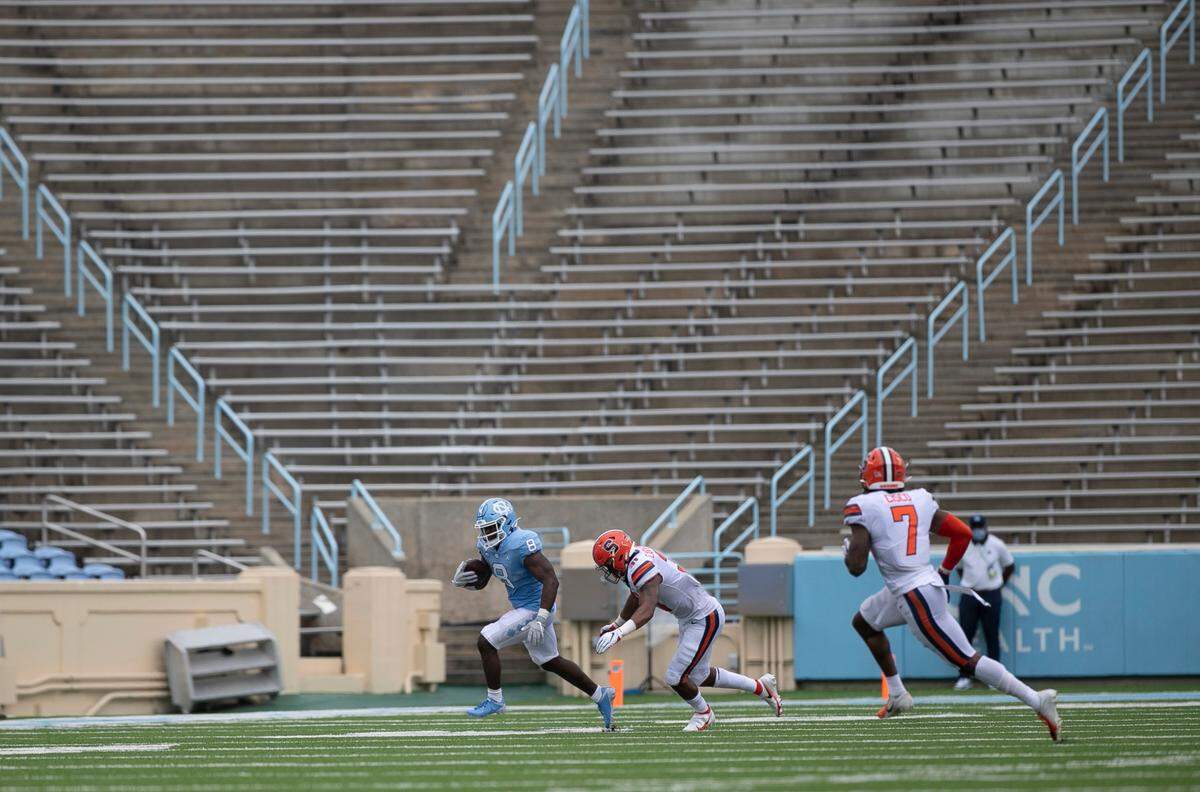 North Carolina’s Michael Carter breaks away from Syracuse’s Geoff Cantin-Arku in the second quarter at Kenan Stadium on Saturday, September 12, 2020 in Chapel Hill, N.C.