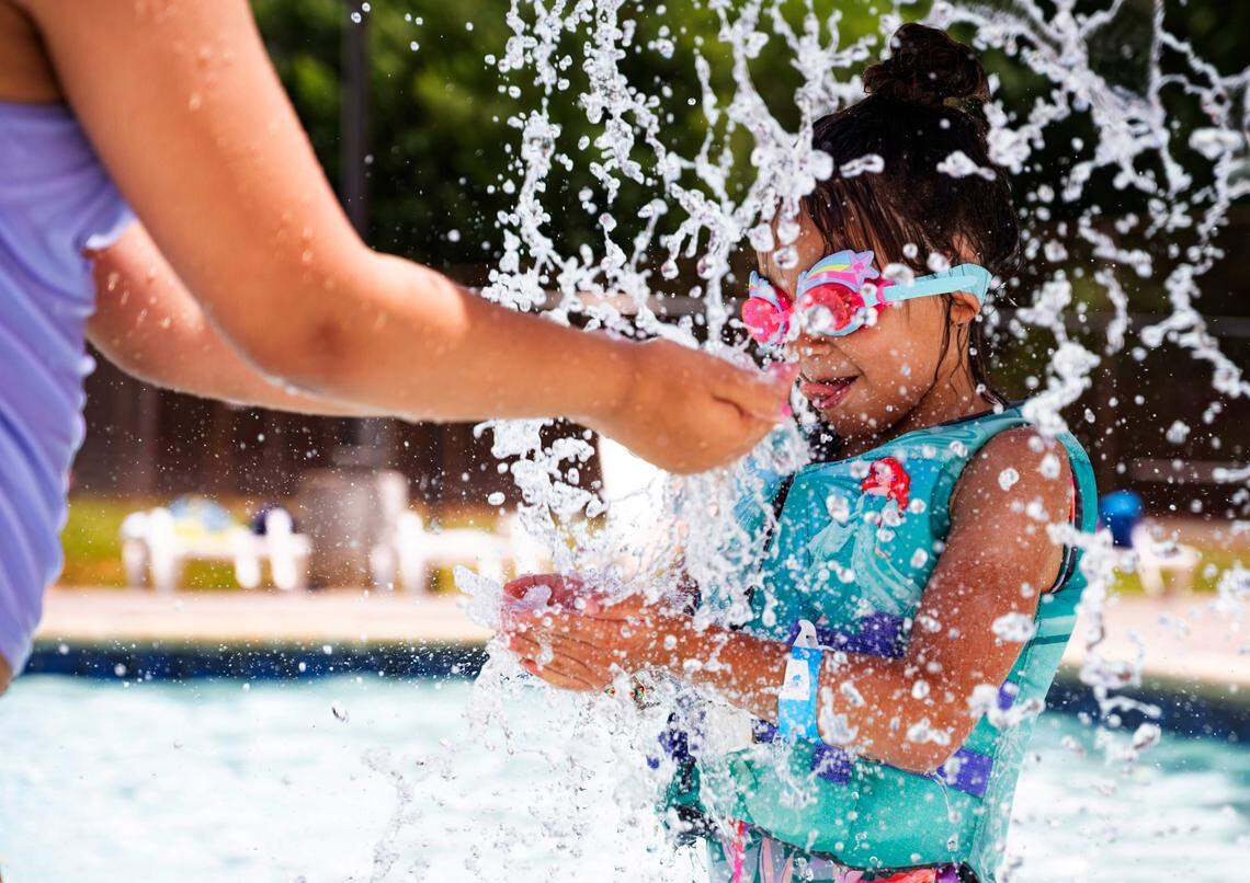 Noemi, 6, plays in the fountain with her friend Leann, 9, at Bray Park Pool on Thursday, June 20, 2024.