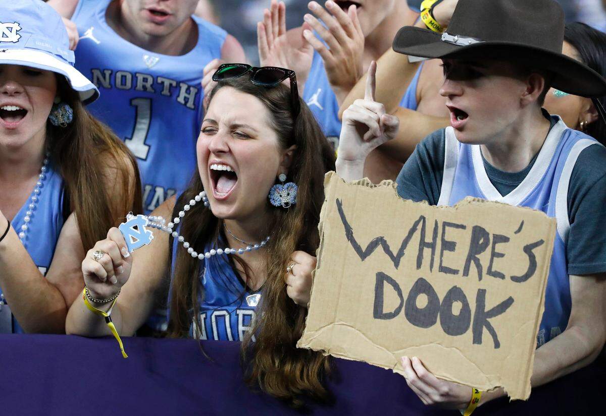 North Carolina students, including seniors Lauren Seale and Matt Kinlaw cheer before UNCs game against Kansas in the NCAA Mens National Championship at the Caesars Superdome in New Orleans, La., Monday, April 4, 2022.