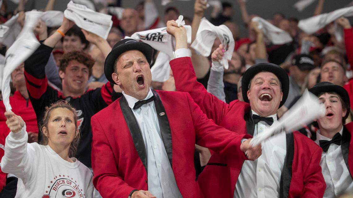 Carolina Hurricanes fans celebrate after a goal by Sebastian Aho in the first period to take a 1-0 lead in game one of their first round Stanley Cup playoff series against the New York Islanders on Monday, April 17, 2023 at PNC Arena in Raleigh, N.C.