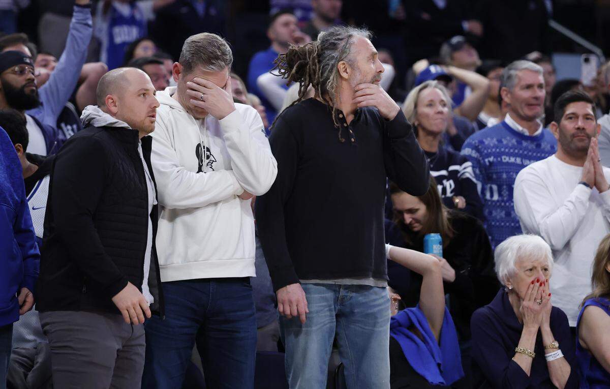 Blue Devils fans react after Duke’s Cameron Boozer missed a free throw late in the second half of Texas Tech’s 82-81 victory over Duke in the SentinelOne Classic at Madison Square Garden in New York City on Saturday, Dec. 20, 2025.