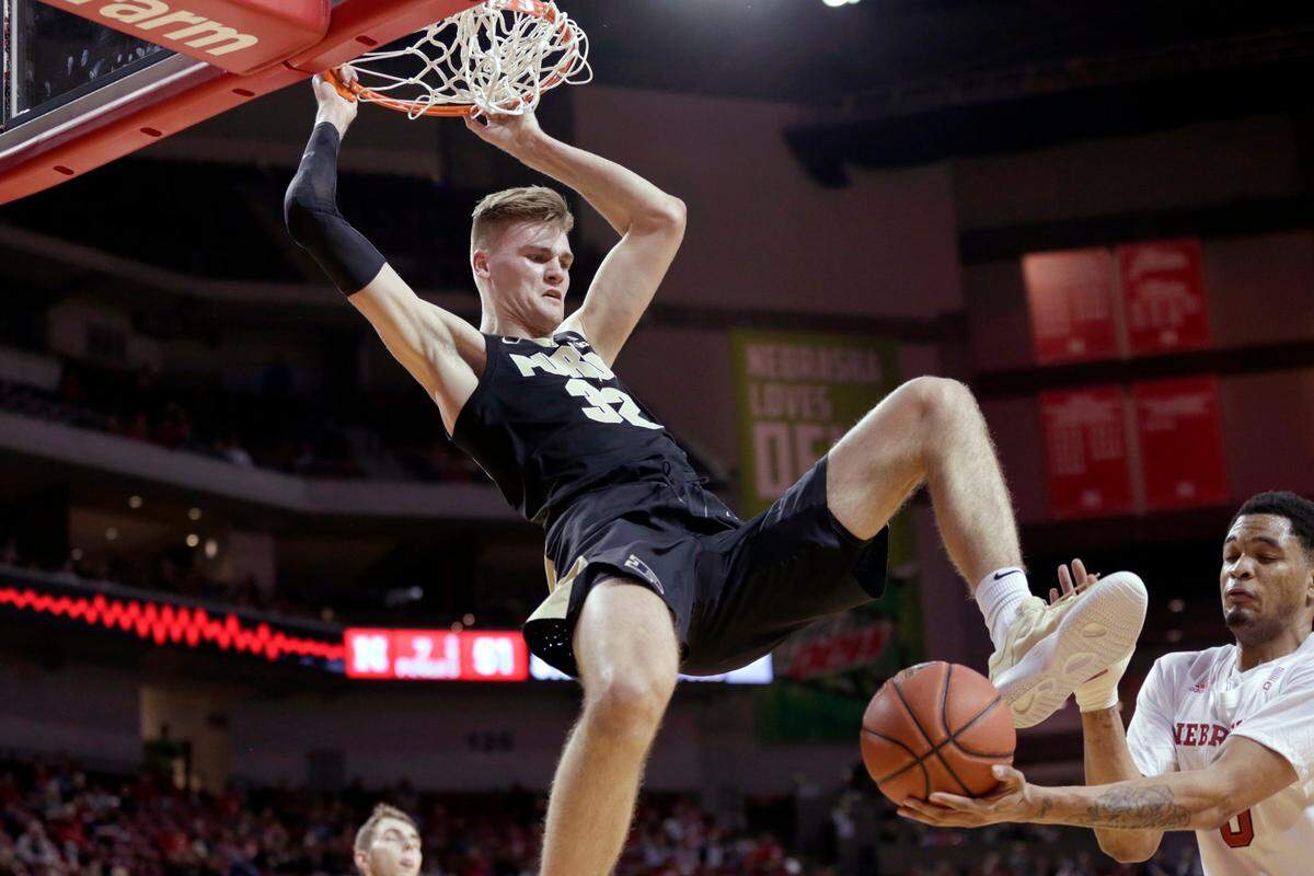 Nebraska’s James Palmer Jr. (0) catches the ball following a dunk by Purdue’s Matt Haarms (32) during the second half of an NCAA college basketball game in Lincoln, Neb., Saturday, Feb. 23, 2019. (AP Photo/Nati Harnik)