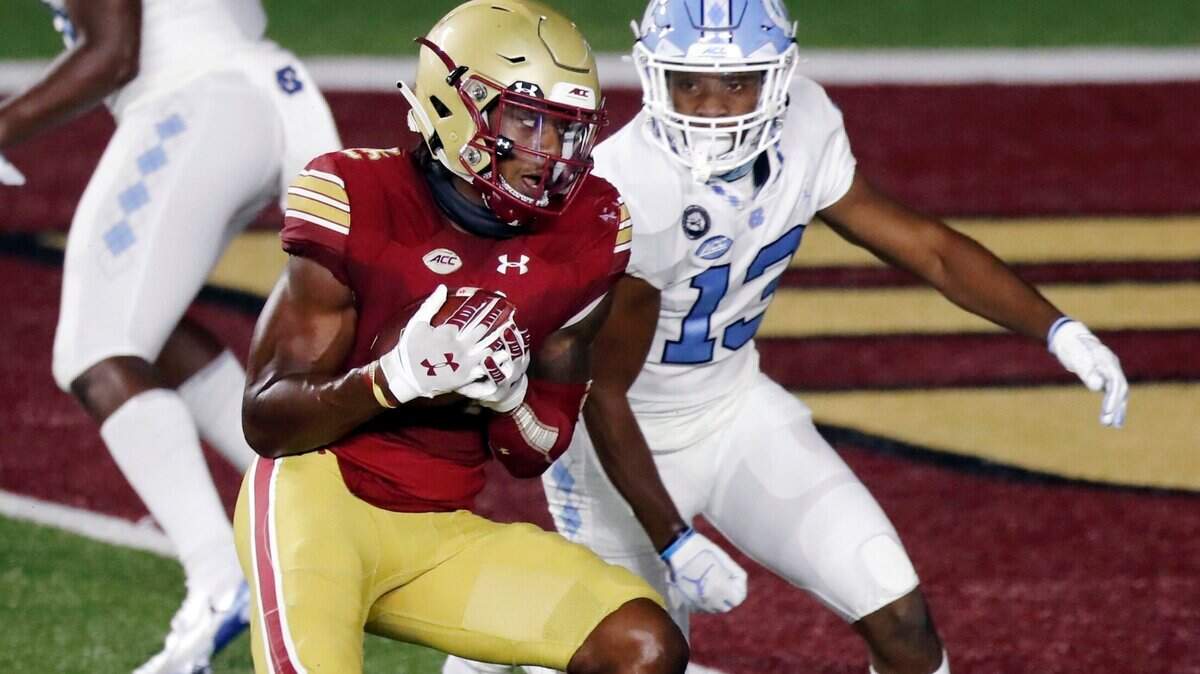 Boston College wide receiver CJ Lewis makes a touchdown reception against North Carolina defensive back Obi Egbuna (13) during the second half of an NCAA college football game, Saturday, Oct. 3, 2020, in Boston. (AP Photo/Michael Dwyer)
