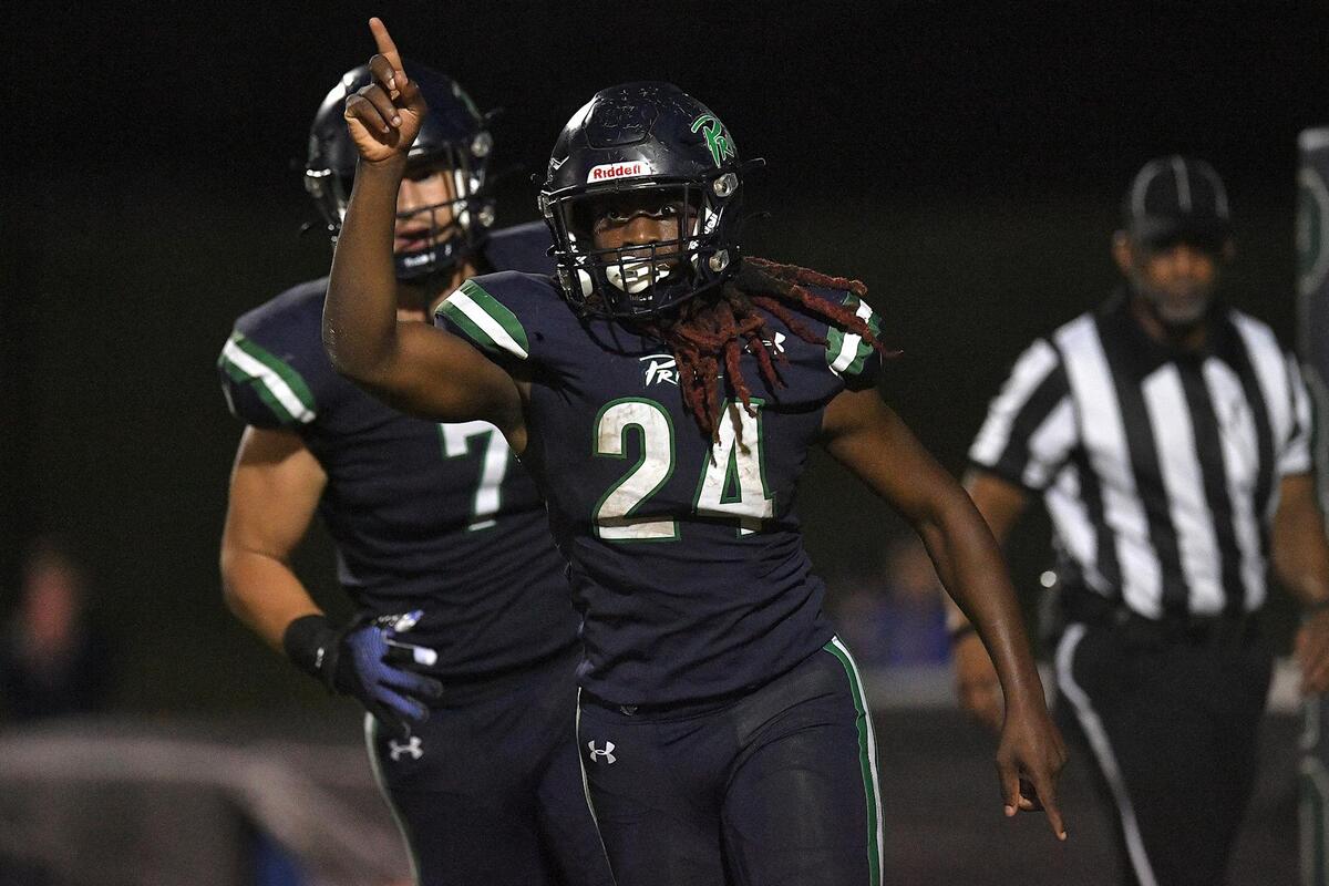 Leesville Road’s Lyfe Shaw-Stephens (24) celebrates the touchdown against Wake Forest in the second half. The Wake Forest Cougars and the Leesville Road Pride met in a football game in Raleigh, N.C. on September 15, 2023.