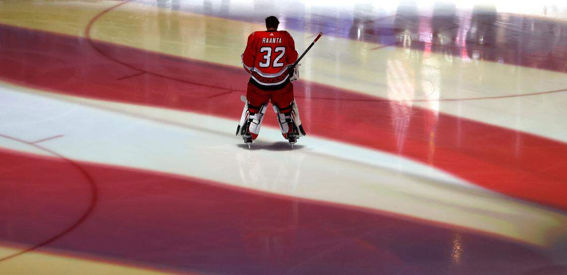 Carolina goaltender Antti Raanta (32) listens during the national anthem before game two between the Hurricanes and Panthers in the Eastern Conference Finals at PNC Arena in Raleigh, N.C., Saturday, May 20, 2023.