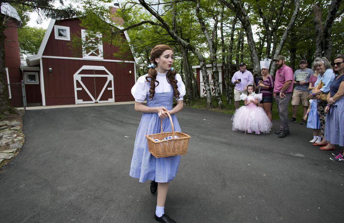 Dorothy take visitors to the Land of Oz atop Beech Mountain for a tour of the yellow brick road during the Journey with Dorothy event on Friday, June 8, 2018.