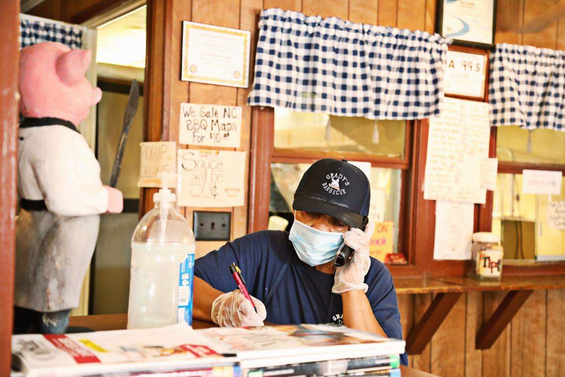 Gerri Grady takes a lunch order over the phone at GradyÕs Barbecue on Friday, Oct. 30, 2020. Gerri and her husband, Steve Grady, have run GradyÕs Barbecue since 1986 in Dudley, NC.