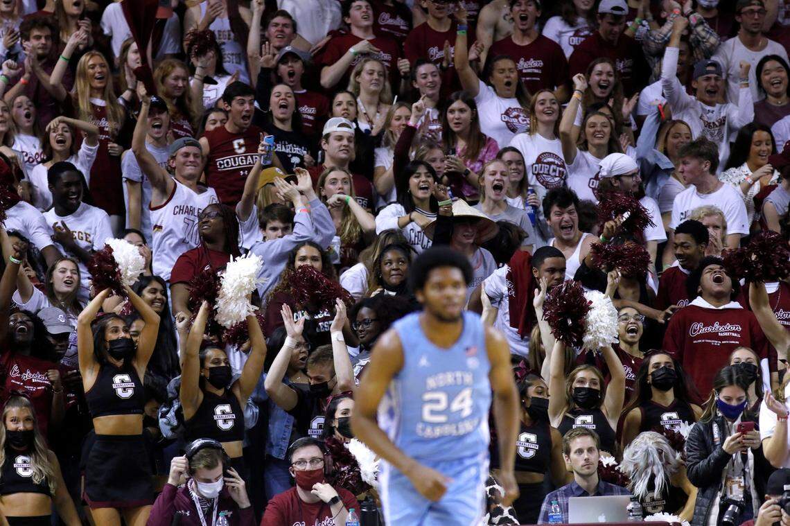 North Carolina’s Kerwin Walton (24) goes up the court as College of Charleston fans cheer a play during the first half of an NCAA college basketball game Tuesday, Nov. 16, 2021, in Charleston, S.C. (AP Photo/Mic Smith)