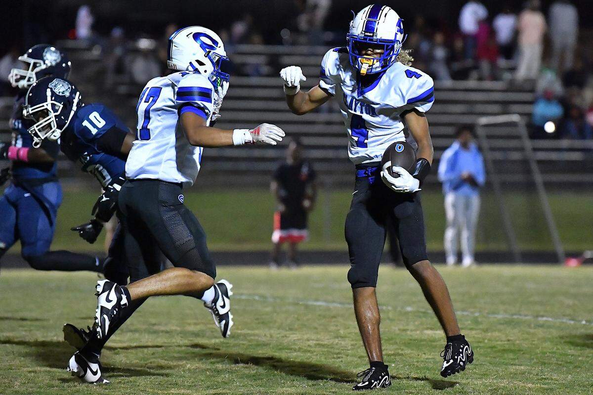 Clayton wide receiver TJ Campbell (4) celebrates his touchdown against Southeast Raleigh with Parker Ferguson (17) during the first half. The Southeast Raleigh Bulldogs and the Clayton Comets met in a non-conference football game in Raleigh, N.C. October 3, 2025