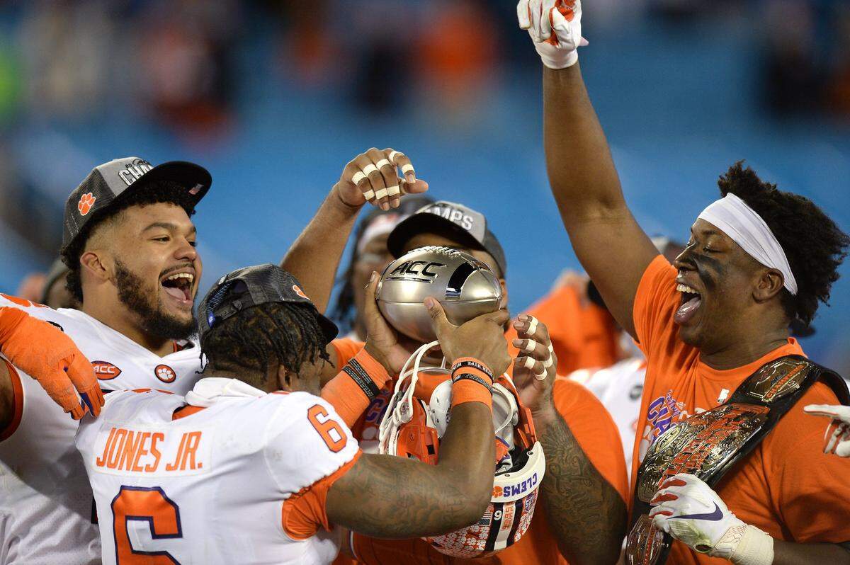 Clemson Tigers celebrate their victory in the ACC Championship game. Clemson defeated Notre Dame 34-10 to win the championship at Bank of America Stadium in Charlotte, NC on Saturday, December 19, 2020.  