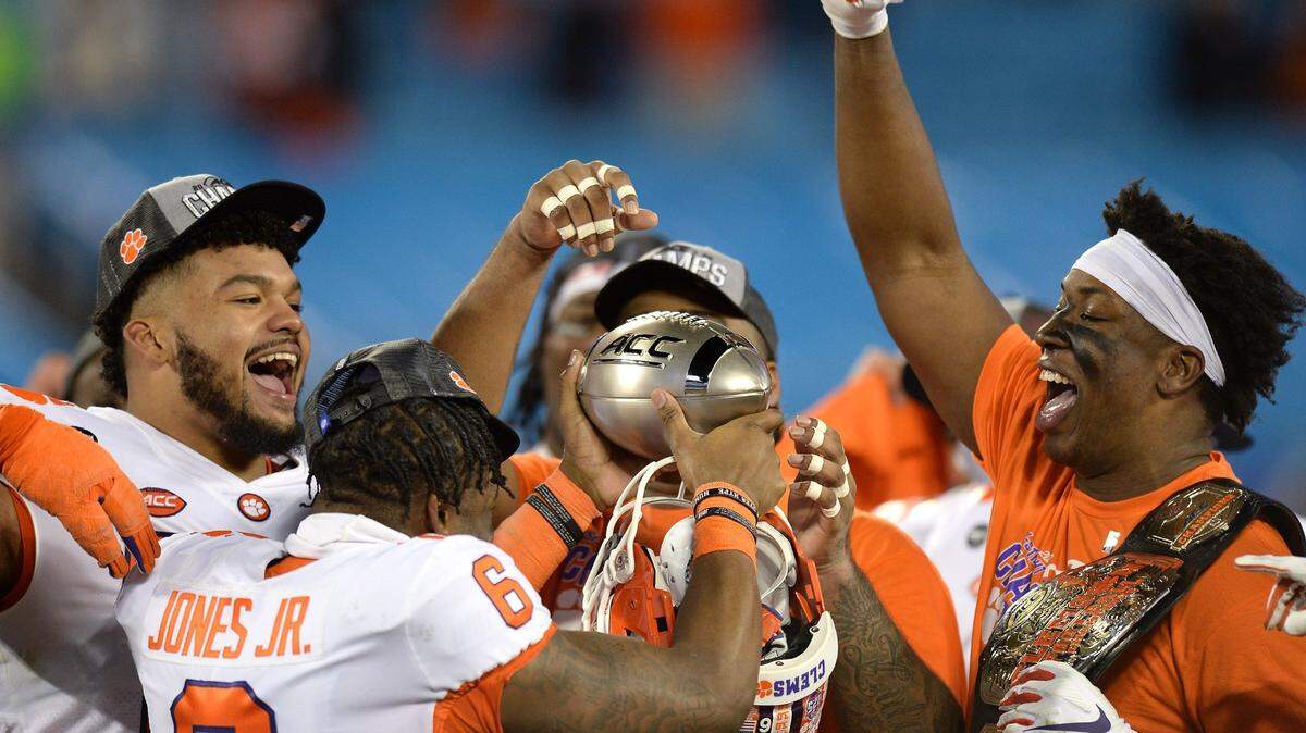 Clemson Tigers celebrate their victory in the ACC Championship game. Clemson defeated Notre Dame 34-10 to win the championship at Bank of America Stadium in Charlotte, NC on Saturday, December 19, 2020.