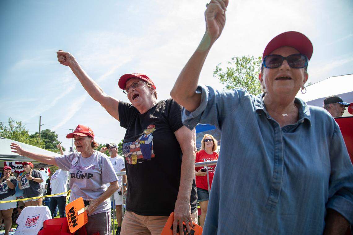 From left, Maureen Fuster, Colleen Filo and Carole Greenberg chant “Trump” while waiting in line to see President Donald Trump Wednesday morning, July 17, 2019 prior to a campaign rally at East Carolina University in Greenville, NC.