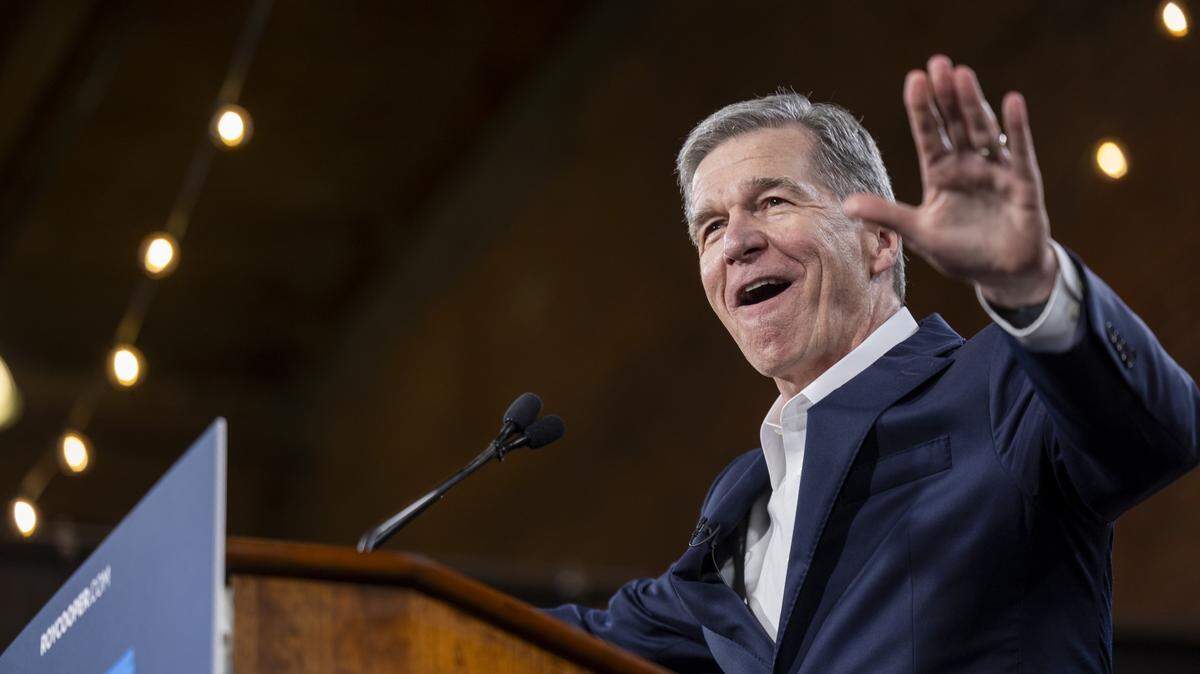Former Gov. Roy Cooper speaks during a “Make Stuff Cost Less” campaign rally on Thursday, April 9, 2026, at Bay 7 in Durham’s American Tobacco Campus. Cooper faces former Republican National Committee Chairman Michael Whatley in the race for U.S. Senate. Both are vying to replace Sen. Thom Tillis, a Republican from Huntersville, who is retiring at the end of his term.