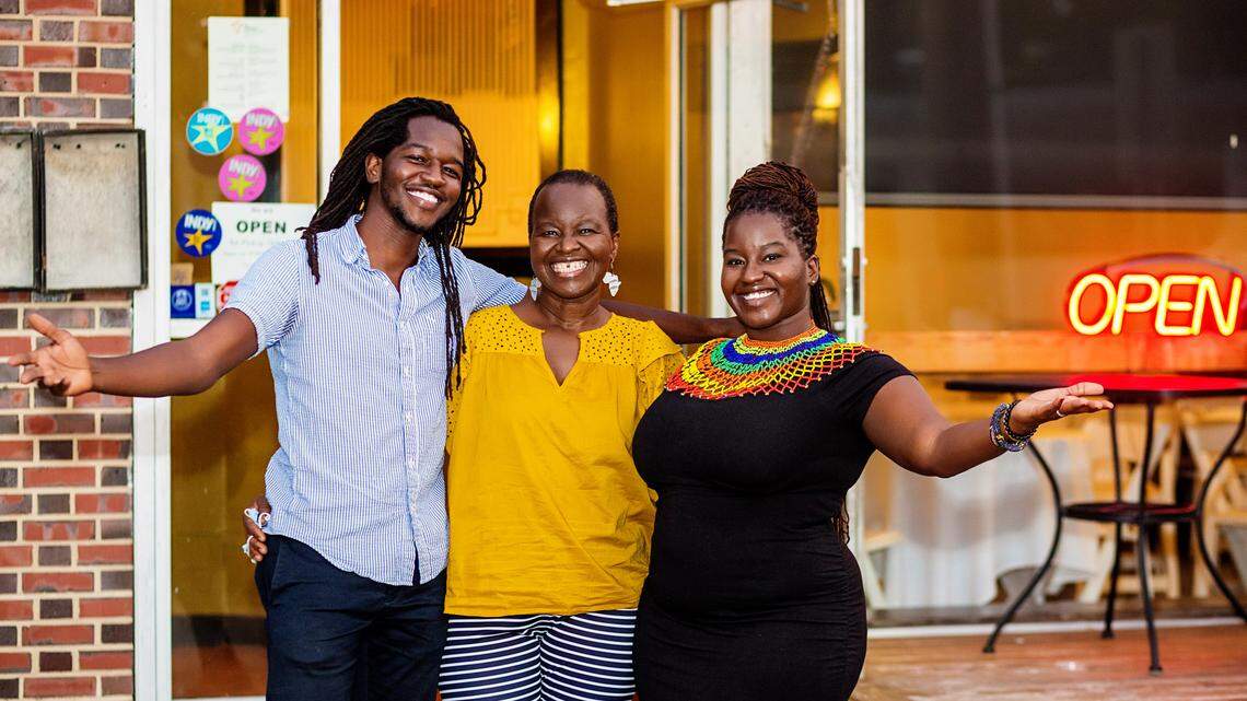Durham restaurant Palace International will closed at the end of the month after 14 years on Broad Street. Owner Caren Ochola, center, and siblings Moses, left and Susanna, right, plan to reopen the restaurant in a new location.