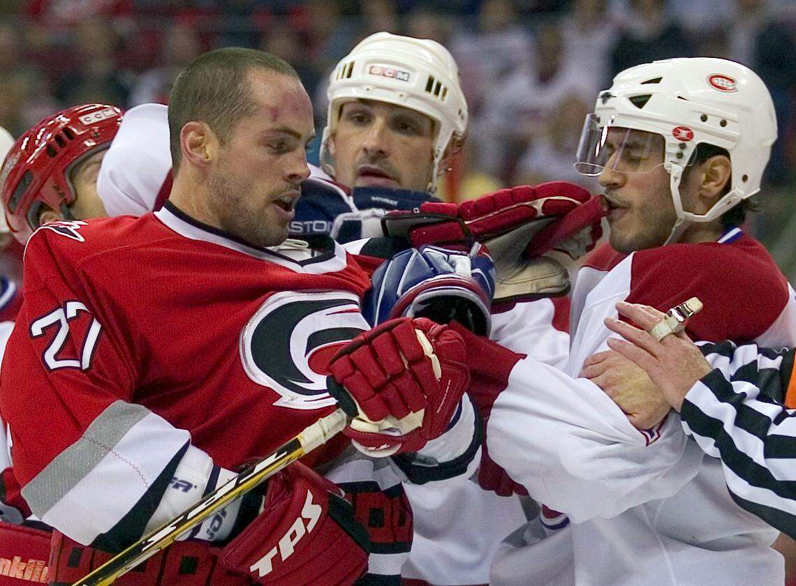 Craig Adams (27) tangles with Montreal’s Mike Ribeiro (71) April 22, 2006 during the first round of the Stanley Cup playoffs.