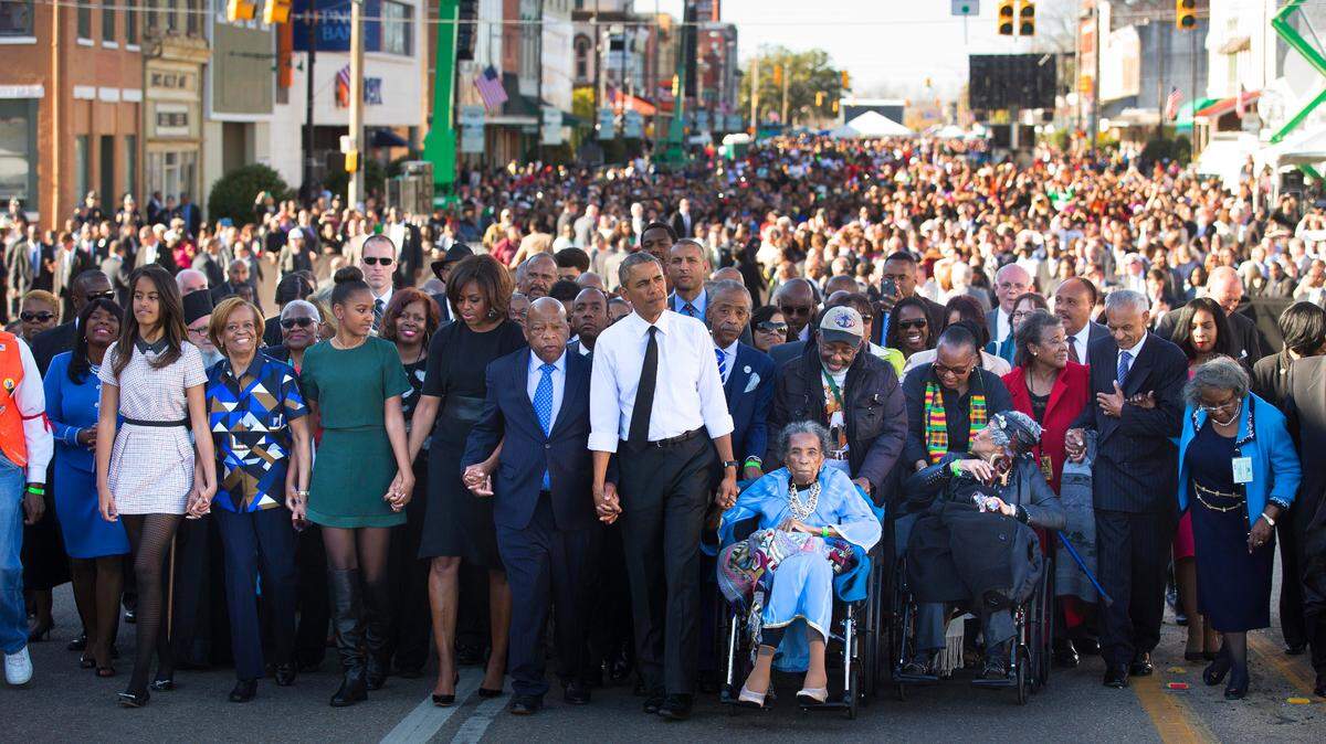 Rep. John Lewis is joined by President Barack Obama and many more in Selma, Ala. on the 50th anniversary of the “Bloody Sunday” march across the Edmund Pettus Bridge, on March. 7, 2015. Lewis, a son of sharecroppers and apostle of nonviolence who was bloodied at Selma and across the Jim Crow South in the historic struggle for racial equality and then carried a mantle of moral authority into Congress, died on Friday, July 17, 2020. He was 80.