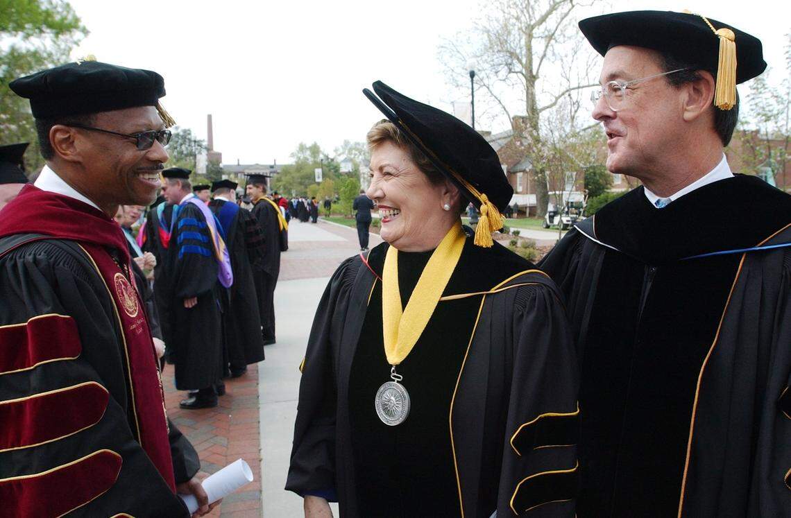 North Carolina Central University Chancellor James H. Ammons, Jr. sees both Molly Broad, past UNC system president and Erskine Bowles, UNC system president, stop to greet Ammons as they head toward the rear of the processional before the start of the official inauguration ceremony for Bowles at Aycock Auditorium at the University of North Carolina at Greensboro on Wednesday, April 12, 2006.