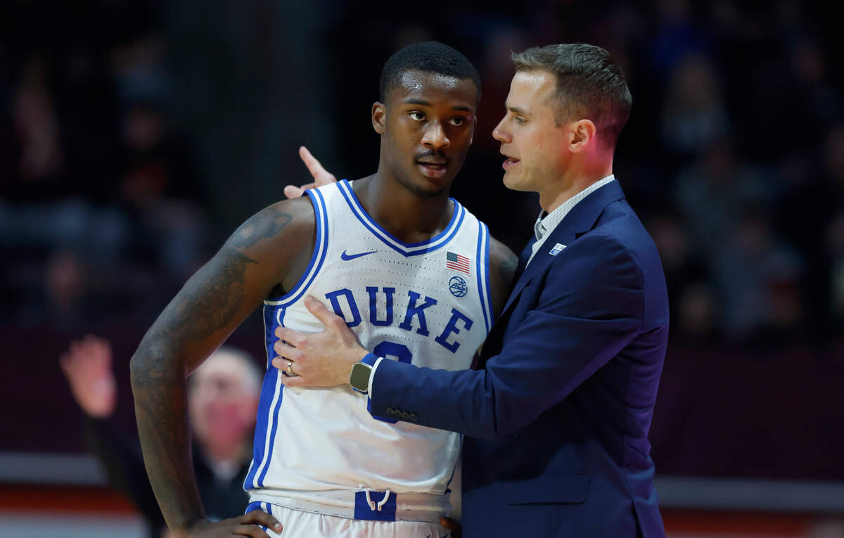 Duke head coach Jon Scheyer talks with Dariq Whitehead (0) during the second half of Virginia Tech’s 78-75 victory over Duke at Cassell Coliseum in Blacksburg, VA., Monday, Jan. 23, 2023.
