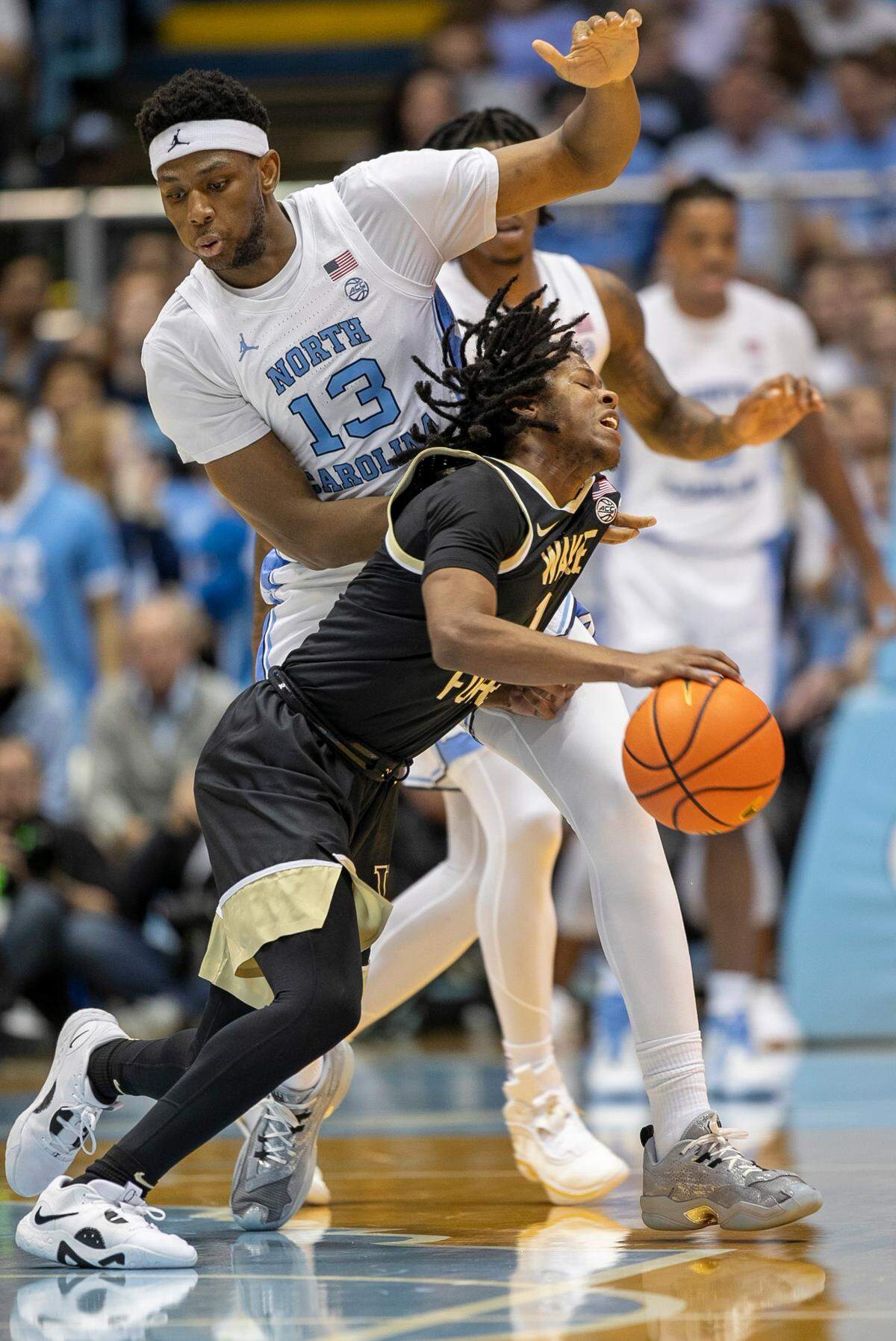 North Carolina’s Jalen Washington (13) defends Wake Forest’s Tyree Appleby (1) in the first half on Wednesday, January 4, 2023 at the Smith Center in Chapel Hill, N.C.