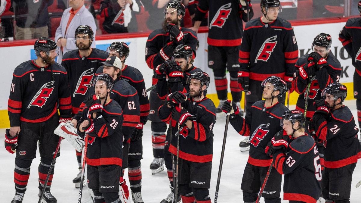 Carolina Hurricanes center Sebastian Aho (20), defenseman Shaye Gostisbehere (04), along with the rest of the team wait to leave the ice following their 5-3 season ending loss to the Florida Panthers on Wednesday, May 28, 2025 at Lenovo Center in Raleigh, N.C.