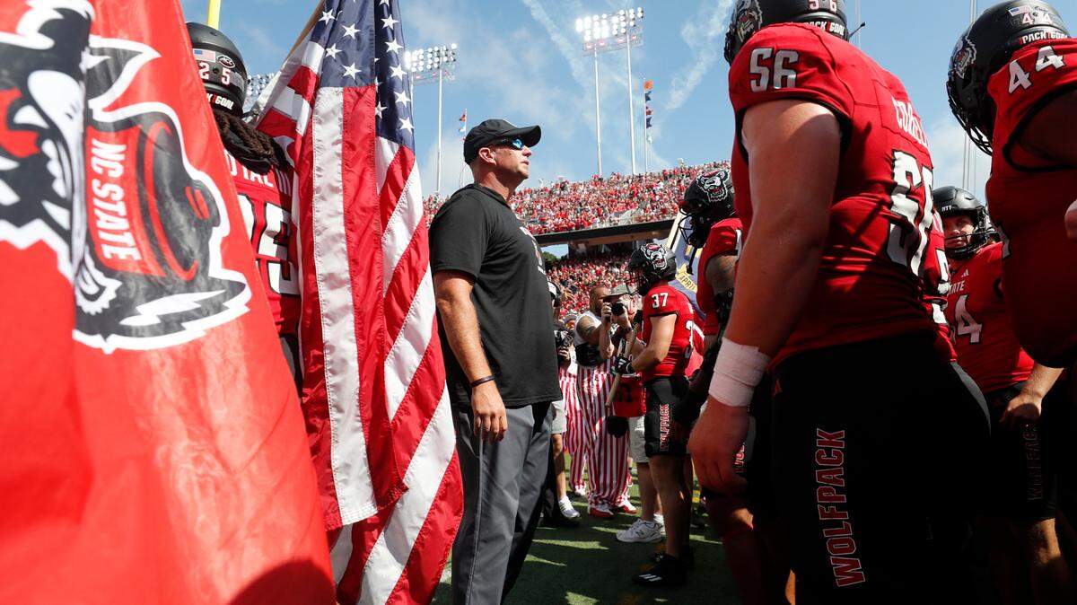 N.C. State head coach Dave Doeren prepares to lead the team out onto the field before their game against Wake Forest at Carter-Finley Stadium in Raleigh, N.C., Saturday, Oct. 5, 2024.