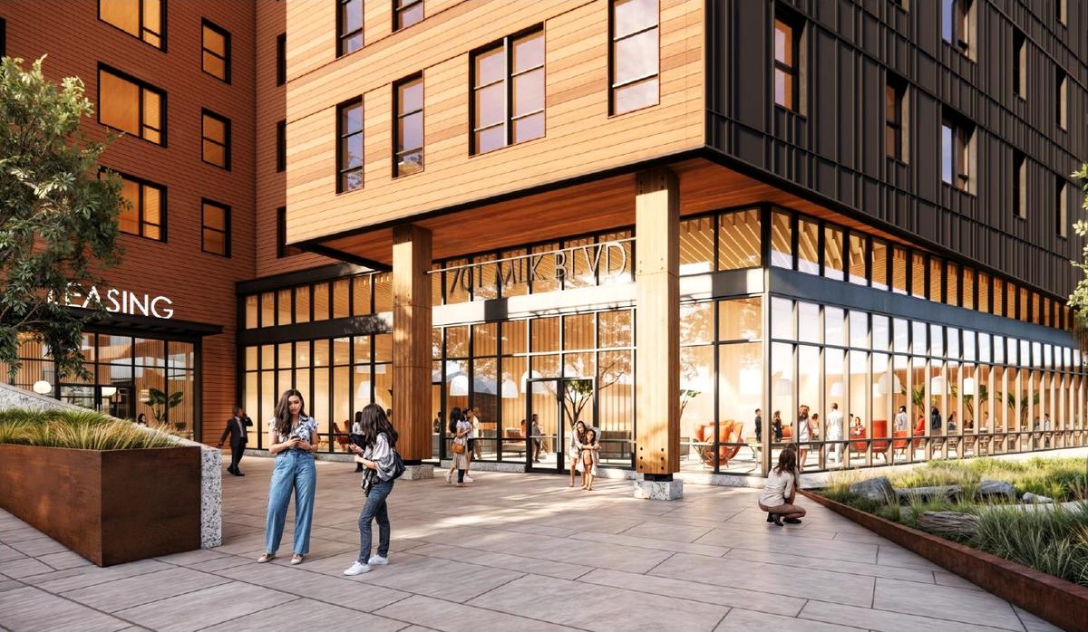 A rendering of apartments proposed for 701 Martin Luther King Jr. Blvd. in Chapel Hill shows a large public plaza at the building’s entrance, where people could gather and wait for the bus.