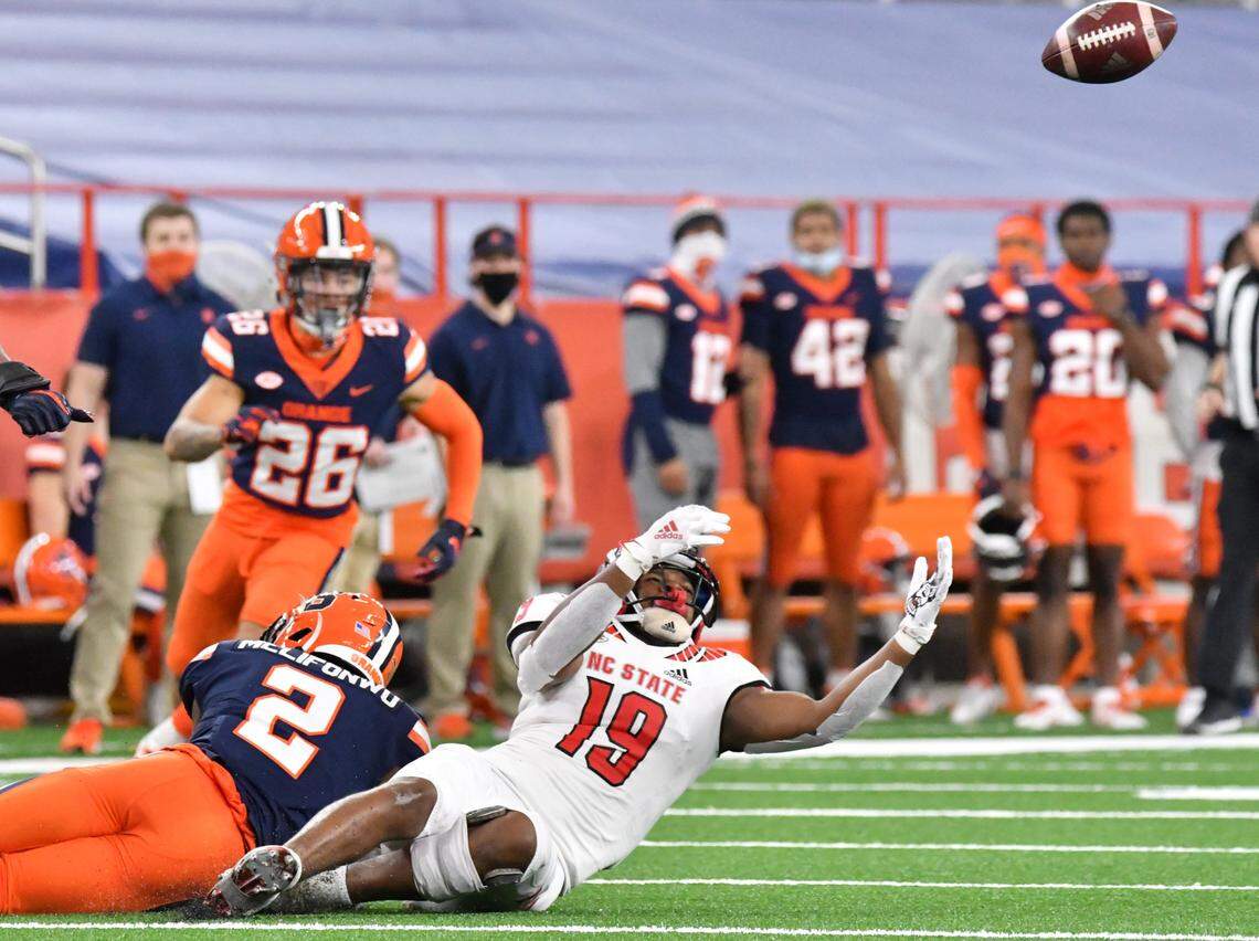 North Carolina State Wolfpack wide receiver C.J. Riley (19) loses control of a catch due to a hit by Syracuse Orange defensive back Ifeatu Melifonwu (2) resulting in an interception in the second quarter at the Carrier Dome.