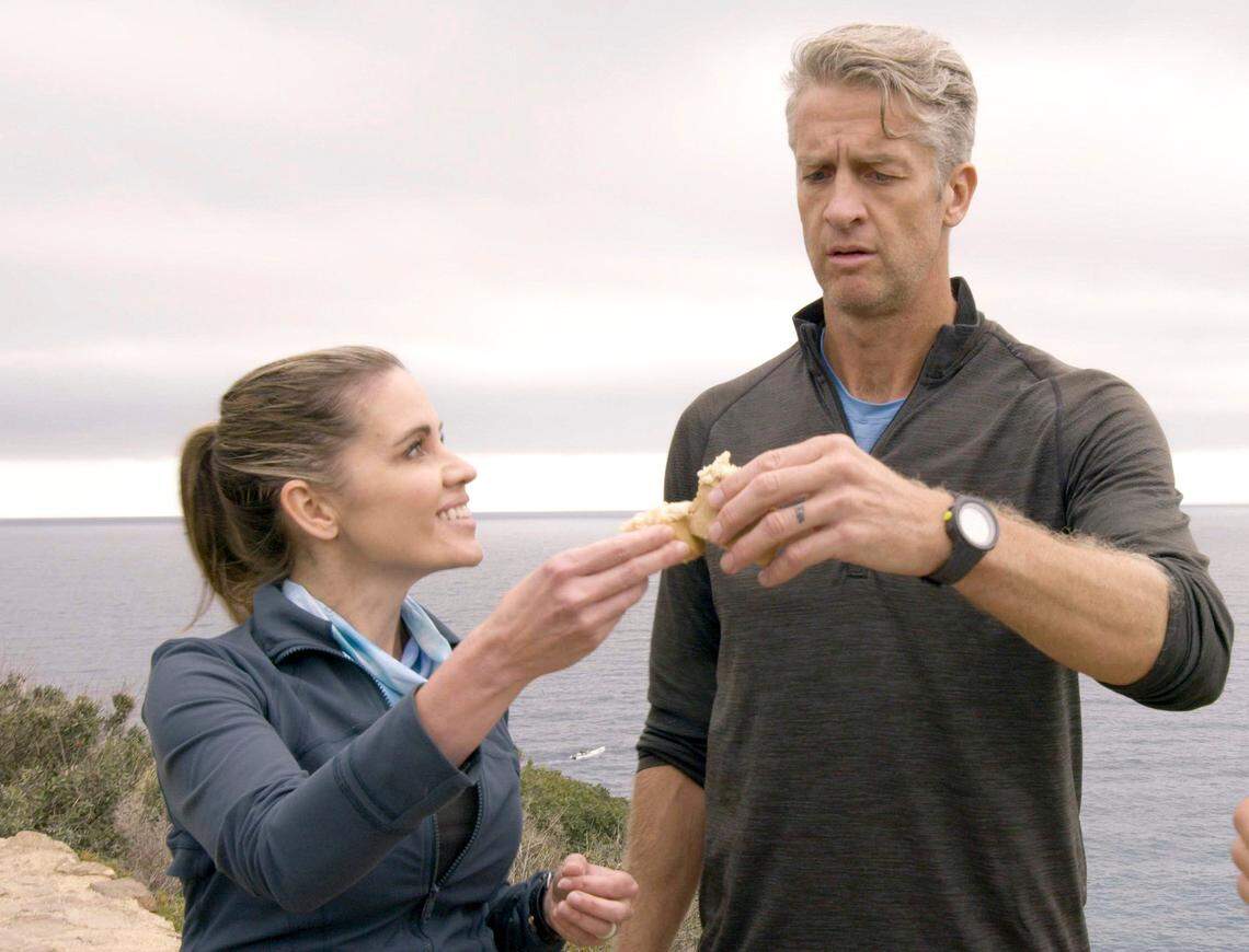 Kim and Penn Holderness try a piece of casu martzu, also known as maggot cheese, on the Feb. 9, 2022, episode of “The Amazing Race.”