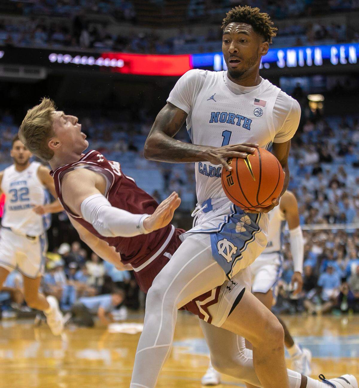 North Carolina’s Leaky Black (1) collides with College of Charleston’s Ryan Larson (11), who was called for blocking, during the first half on Friday, November 11, 2022 at the Smith Center in Chapel Hill, N.C.