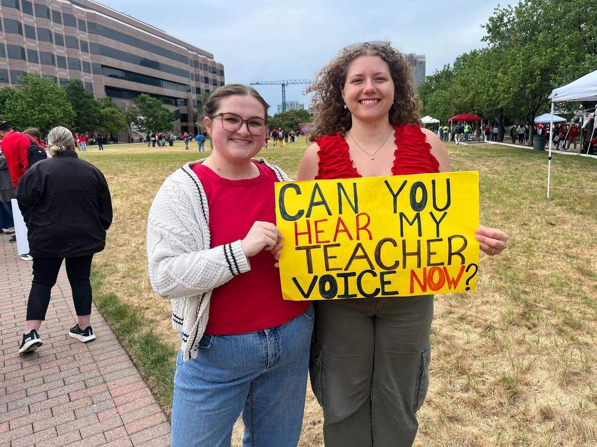 Raegan Amos left, Emma Austin right arrived early for the teacher march in Raleigh.