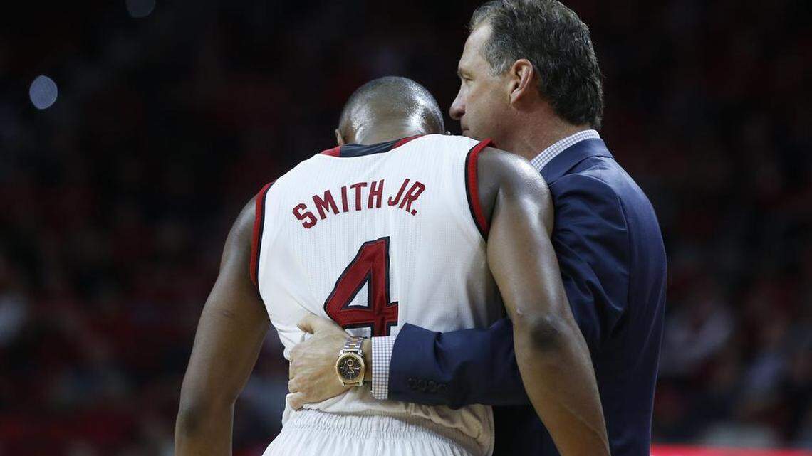 N.C. State coach Mark Gottfried talks with Dennis Smith Jr. during the Wolfpack's 104-78 victory over Virginia Tech at PNC Arena in Raleigh, N.C., Wednesday, January 4, 2017.