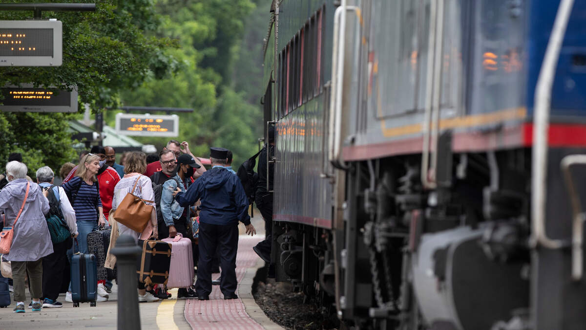 TThis 2022 file photo shows passengers boarding Amtrak’s Piedmont train in Cary, N.C. The Piedmont offers daily service to Charlotte, Kannapolis, Salisbury, High Point, Greensboro, Burlington, Durham, Cary and Raleigh.