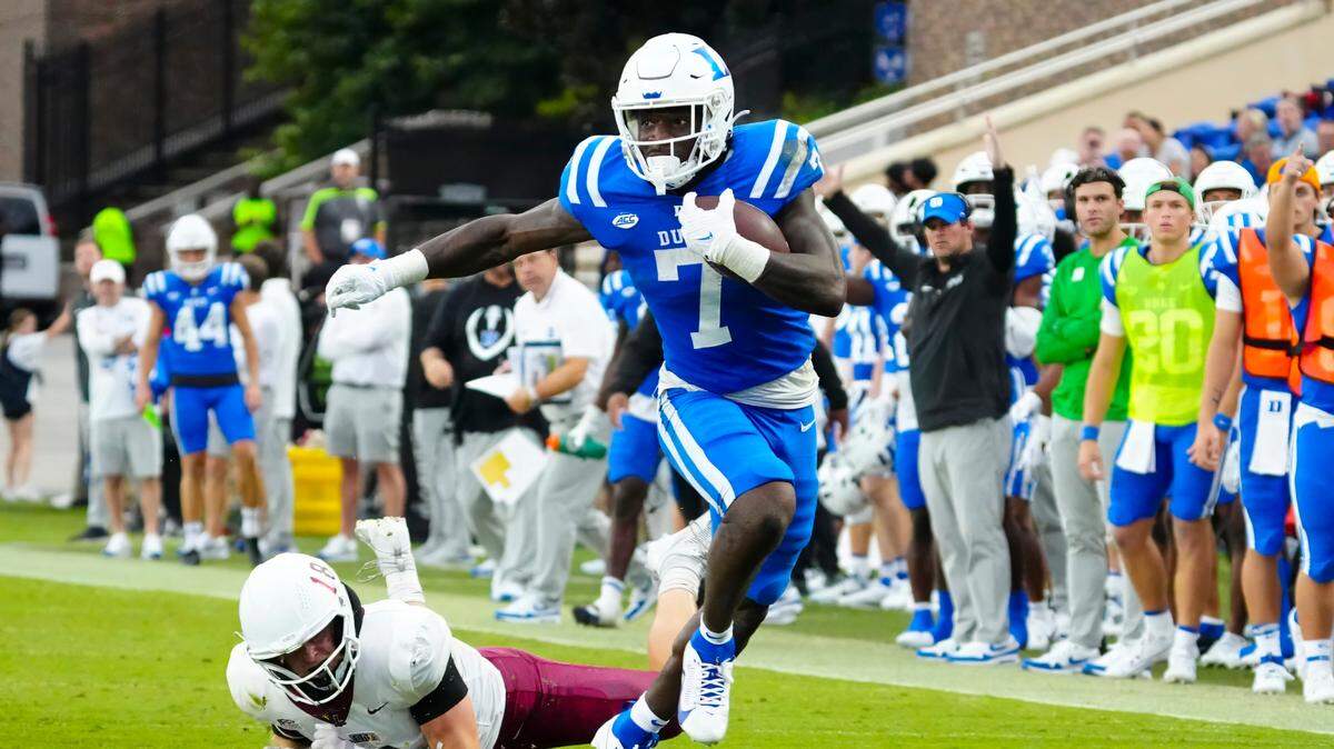 Sep 9, 2023; Durham, North Carolina, USA; Duke Blue Devils running back Jordan Waters (7) makes a catch past Lafayette Leopards linebacker Preston Forney (18) during the first half at Wallace Wade Stadium. Mandatory Credit: James Guillory-USA TODAY Sports