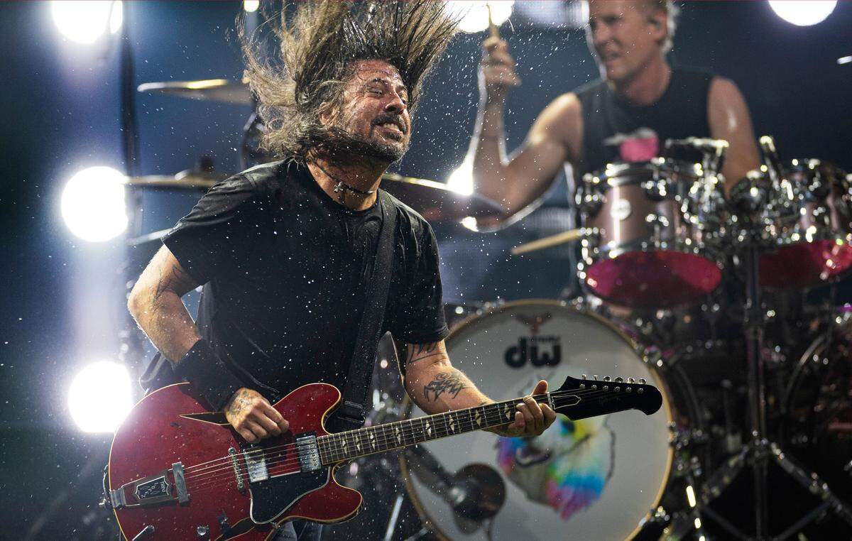 Water flies through the air after Dave Grohl dumped a cup of water on his head as he and Foo Fighters rocked hard at Raleigh, N.C.’s Coastal Credit Union Music Park at Walnut Creek, Tuesday night, May 7, 2024.