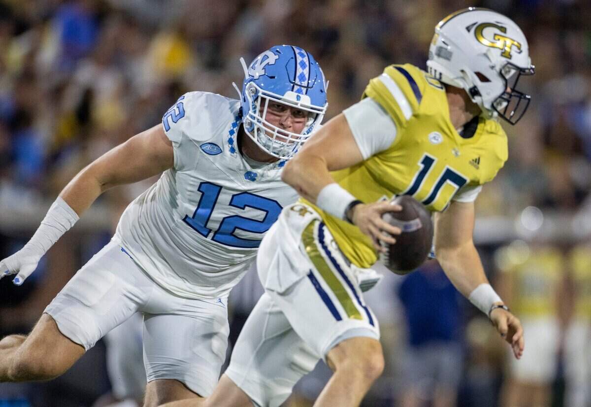 North Carolina’s Beau Atkinson pressures Georgia Tech quarterback Haynes King (10) in the first quarter on Saturday, October 28, 2023 at Bobby Dodd Stadium in Atlanta, Georgia.