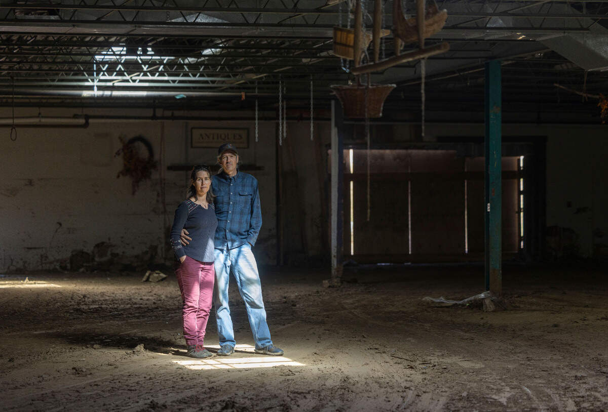 Whitney and George Brasington pose for a portrait on Tuesday, March 11, 2025 in Micaville, N.C., in the former Taylor Toggs manufacturing plant they converted into a mixed use building. More than six feet of water from Little Crabtree Creek at the height of Hurricane Helene destroyed the building.