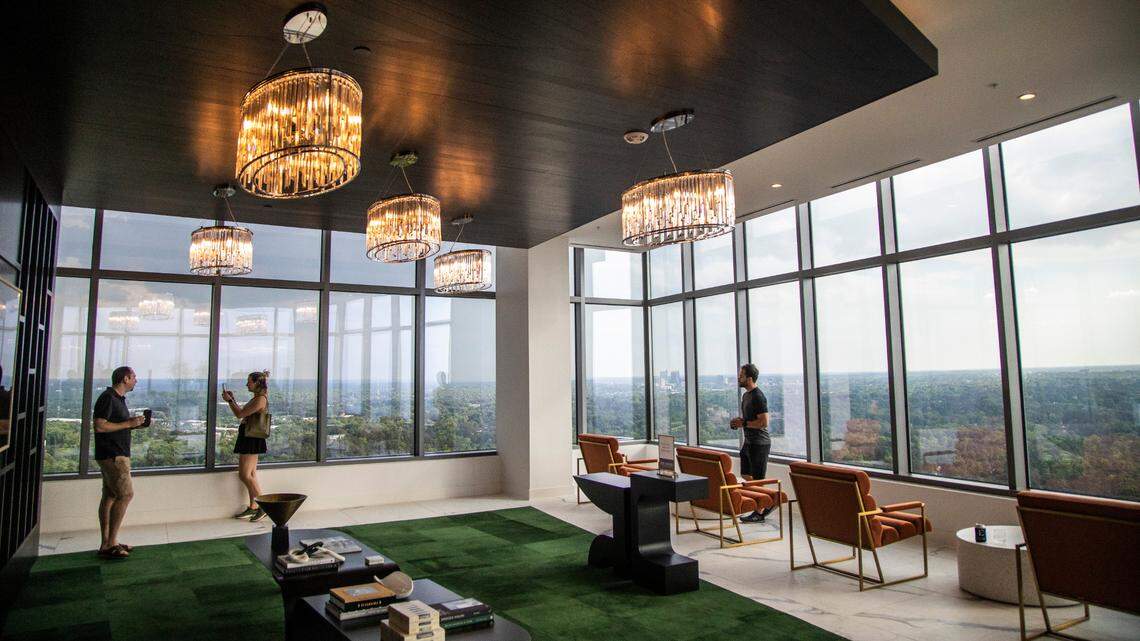 Potential renters tour Kane Realty’s 36-story luxury apartment tower off Six Forks Road called the Eastern Residences at North Hills in Raleigh Friday, May 6, 2022.