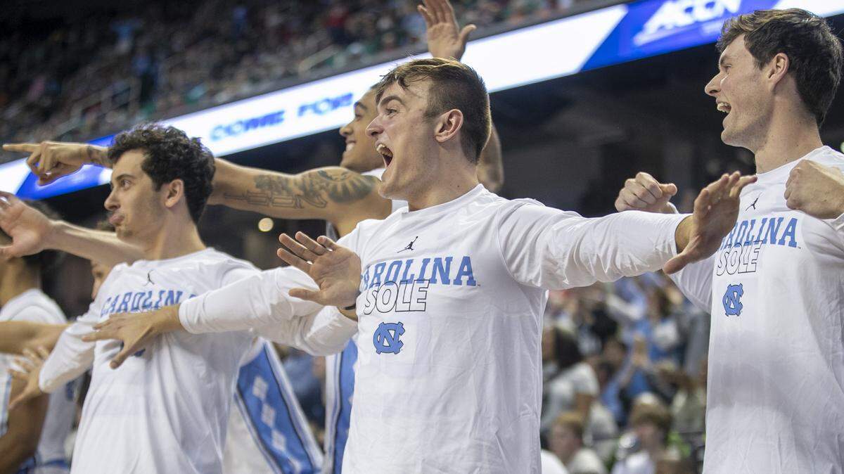 North Carolina’s Jackson Watkins (30) leads the celebration on the Tar Heels’ bench after a dunk Dontrez Styles (3) in the second half against Boston College during the second round of the ACC Tournament on Wednesday, March 8, 2023 at the Greensboro Coliseum in Greensboro, N.C.