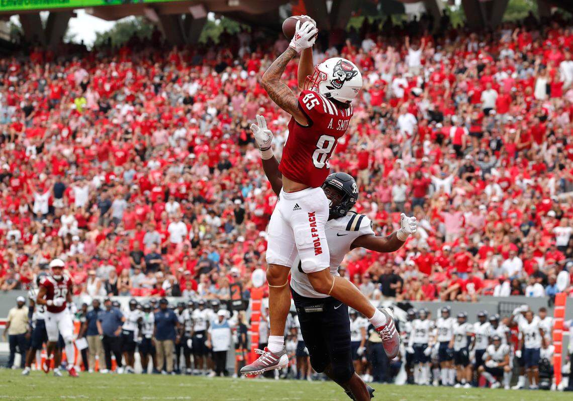 N.C. State wide receiver Anthony Smith (85) pulls in a 40-yard touchdown reception as Charleston Southern cornerback Kamron Smith (6) defends during the first half of N.C. State’s game against Charleston Southern at Carter-Finley Stadium in Raleigh, N.C., Saturday, Sept. 10, 2022.