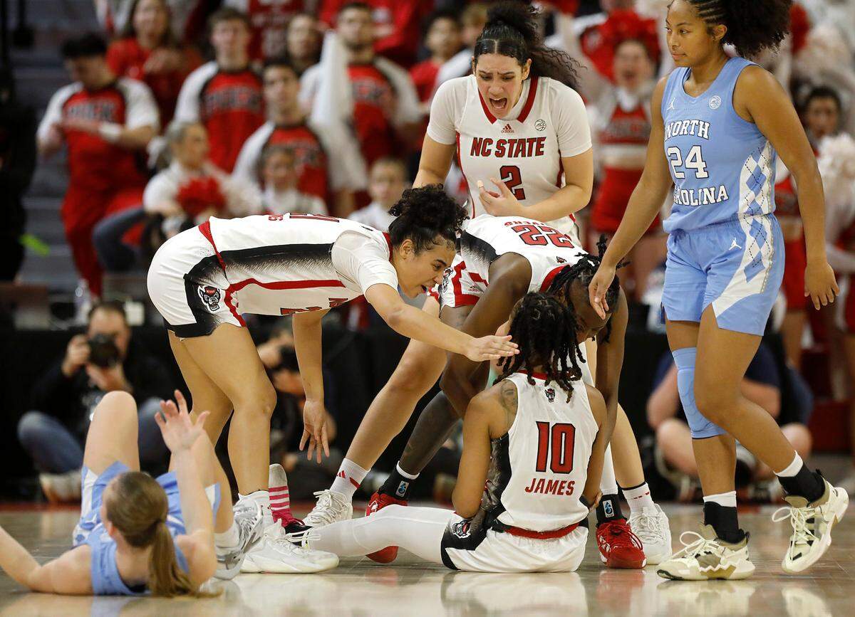 Teammates react after N.C. State’s Aziaha James drew an offensive foul during the second half of the Wolfpack’s 63-59 win over North Carolina on Thursday, Feb. 1, 2024, at Reynolds Coliseum in Raleigh, N.C.
