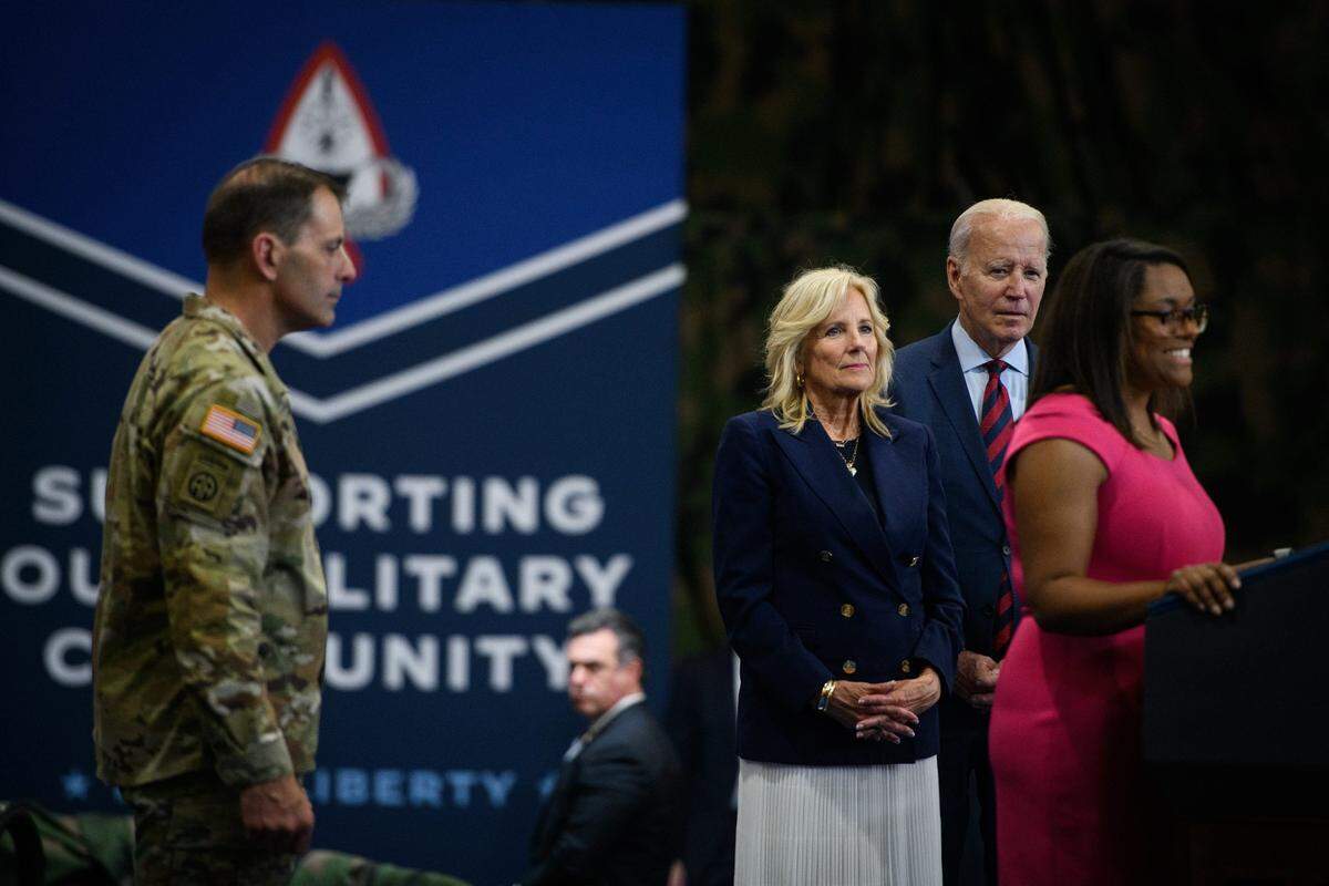 President Joe Biden and his wife, Jill Biden, listen to Tiffany Zoeller speak at Fort Liberty on Friday, June 9, 2023. President Joe Biden visited Fort Liberty and signed an executive order to support military-connected families.