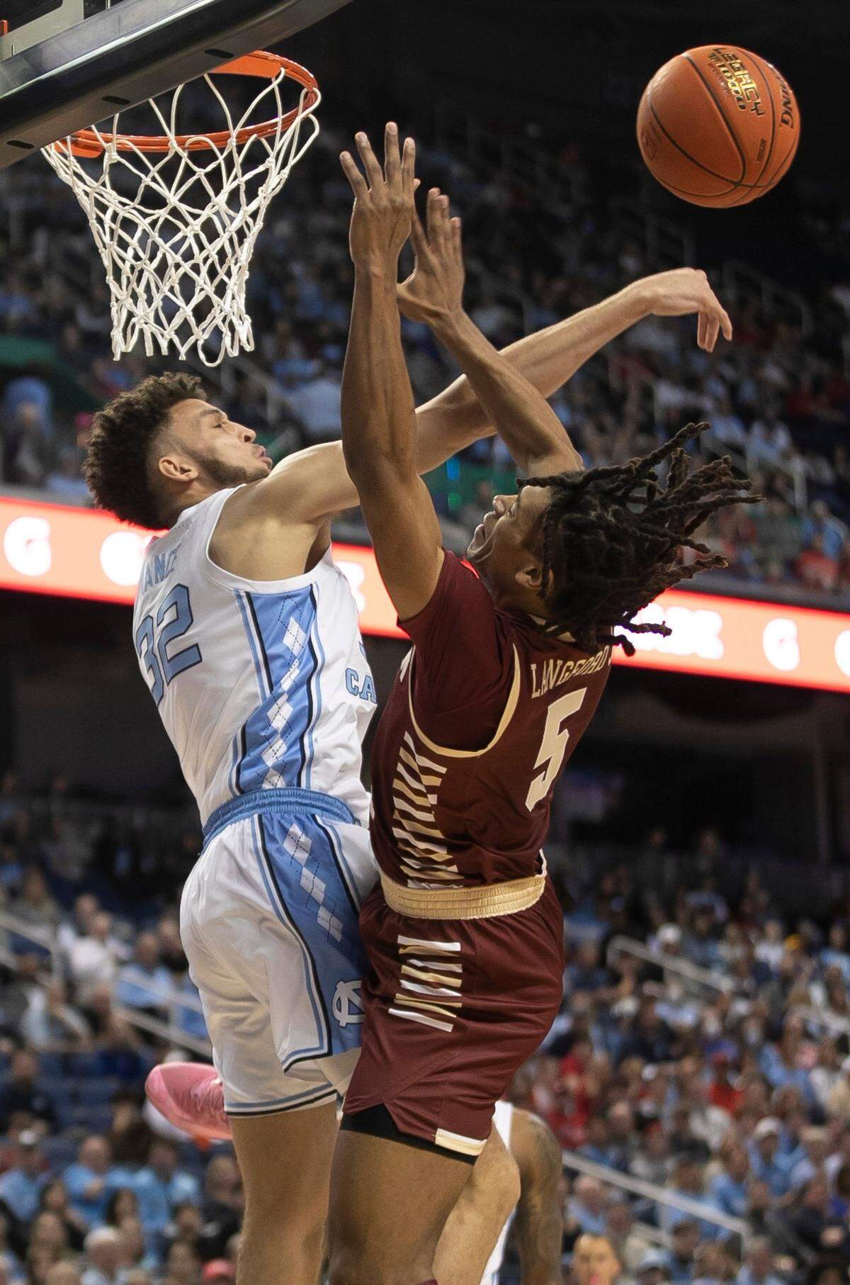 North Carolina’s Pete Nance (32) blocks a shot by Boston College’s DeMarr Langford Jr. (5) during the first half in the second round of the ACC Tournament on Wednesday, March 8, 2023 at the Greensboro Coliseum in Greensboro, N.C.