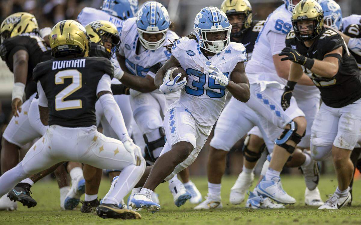 North Carolina running back Demon June (35) breaks open for a 13-yard gain in the second quarter against the University of Central Florida on Saturday, September 20, 2025 at Acrisure Bounce House Stadium in Orlando, Fla.
