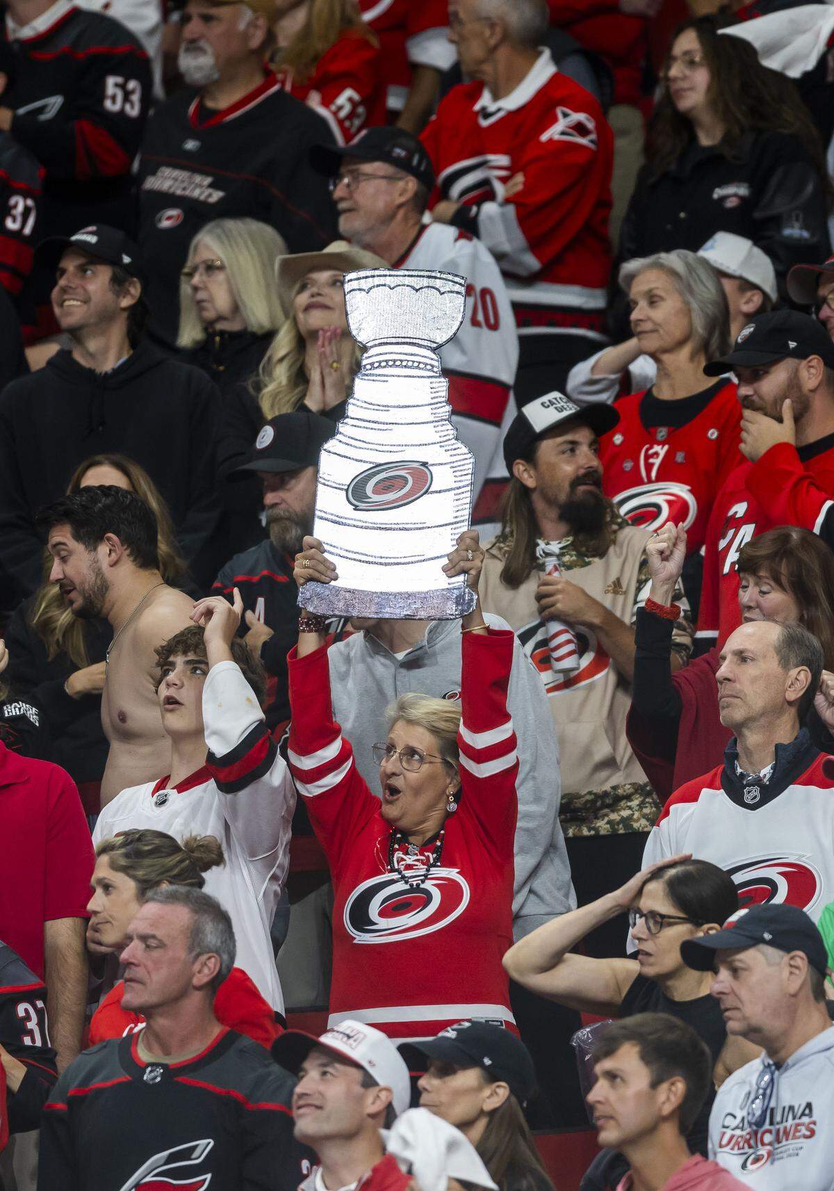 Carolina Hurricanes fans show their support for the team at the start of the overtime period, during Game 2 of the Stanley Cup Final, on Thursday, June 4, 2026 at Lenovo Center in Raleigh, N.C.