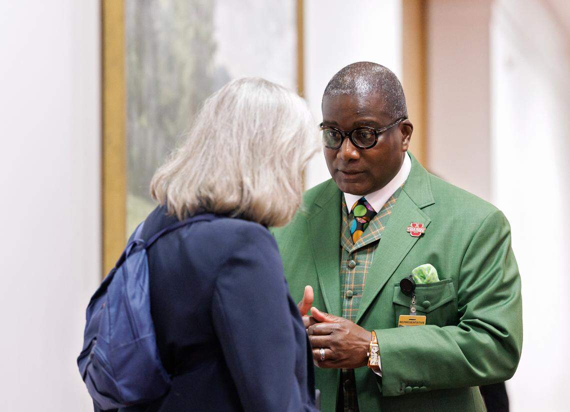 Rep. James Roberson, a Democrat from Wake County, talks with Rep. Becky Carney, a Democrat from Mecklenburg County, during a break in session in the House chamber of the Legislative Building on Wednesday, May 21, 2025, in Raleigh, N.C.