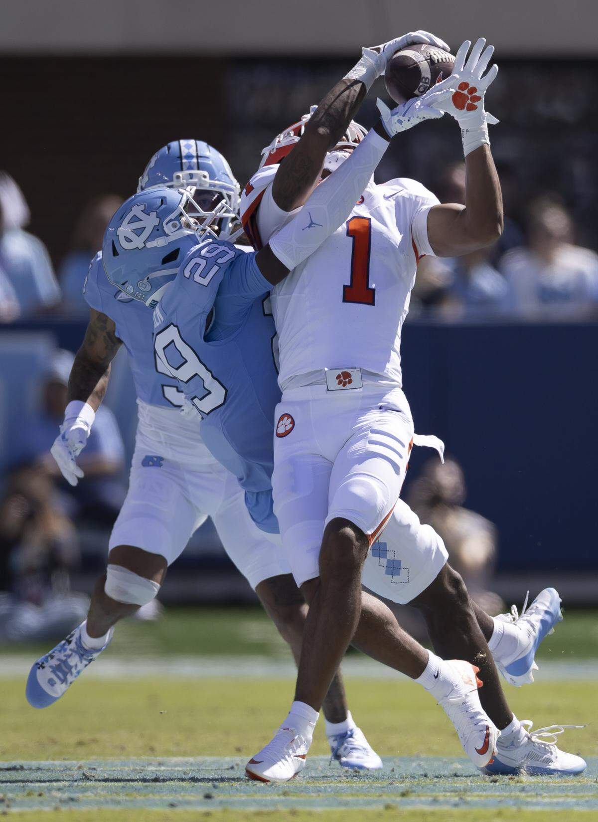 Clemson wide receiver T.J. Moore (1) pulls in a pass from quarterback Cade Klubnik over North Carolina defensive back Marcus Allen (29) in the second quarter on Saturday, October 4, 2025 at Kenan Stadium in Chapel Hill, N.C. 