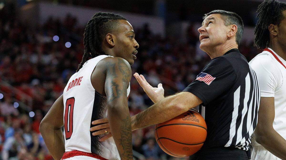 N.C. State’s DJ Horne speaks with an official during the first half of the Wolfpack’s 67-54 loss to North Carolina at PNC Arena on Wednesday, Jan. 10, 2024, in Raleigh, N.C.