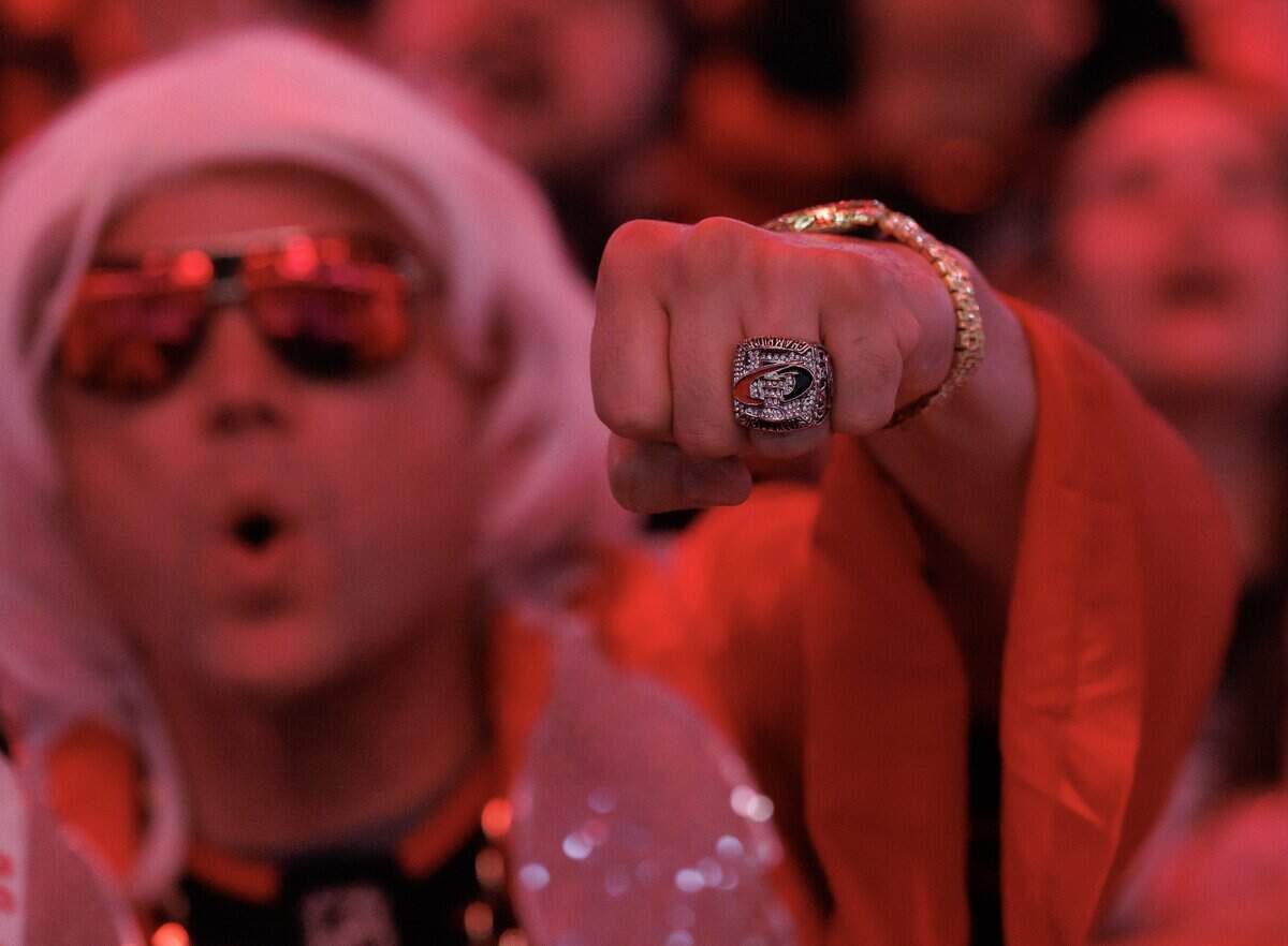 A Carolina Hurricanes fan shows off a championship ring during a watch party for game 6 of the Stanley Cup Final at the Lenovo Center on Sunday, June 14, 2026, in Raleigh, N.C.